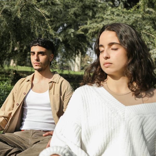 A focused man meditating after a workout, showing mental clarity and peace.